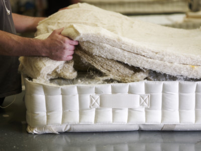 Natural Fillings Being Layered Into A Mattress